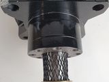 a close up of a black oil pressurer on a white surface