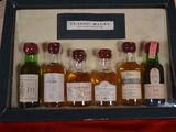 six bottles of alcohol in a display case