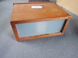 a small wooden box that has a label on it