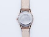an image of a close up of a wrist watch on a white surface