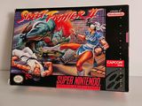 une photo d'une boîte du jeu Street Fighter X posée sur une table