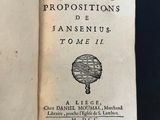 an open book with a black and white title on it