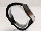 a black and silver watch on a clear stand