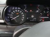 a close up of a car dashboard with a speedometer and gauges