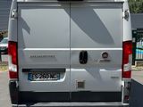 a white van that is parked on the side of the road