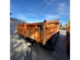 an image of a dump truck parked in a parking lot