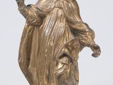 une image représentant une statue d'un homme tenant un oiseau dans la main