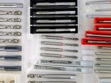 many different types of drill bits in a box