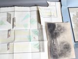 a box with a lot of old papers and a picture of a tree in it