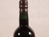 a bottle of wine that is sitting on a table