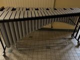an image of a musical instrument on wheels in a room