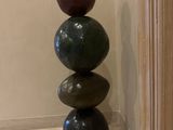 a stack of stones on top of each other in a room