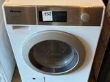 a washing machine sitting next to a dryer on the floor