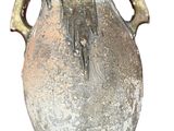 a vase with a bird on it on a white background
