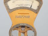 a close up of a parking meter with a clock on it