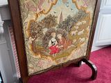 a picture of a painting on a stand in a room