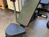 a bench that is sitting on the floor in the room
