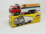 two toy trucks that are sitting on top of each other