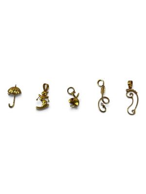 four pairs of gold earrings on a white background
