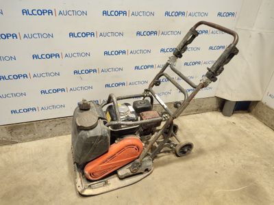 an image of a small lawn mower in a garage