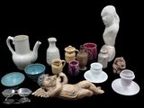 many different types of vases and bowls on the table