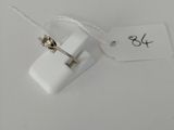 a small white object with a tag attached to it