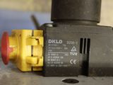 a close up of a yellow and black valve on a table