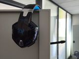 a pair of headphones hanging on a wall in an office
