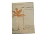 an old book with a picture of a palm tree on it