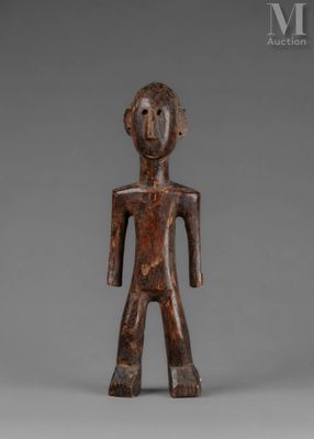 a wooden figure of a man with a head and arms