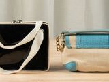 two purses that are sitting on a table