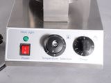 a close up of a machine that has a heat light on it
