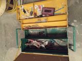 a yellow tool box with tools in it on the floor
