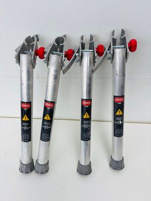 four different types of pipe cutters are lined up on a counter