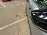 many cars parked in a parking lot in a parking lot