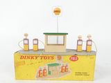 a box of dinky toys on a white surface