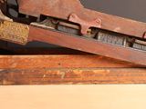 an old type of printing machine that is on display