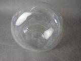 a clear glass ball sitting on a table