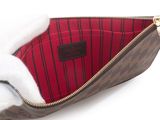 an image of a purse with a red and black striped lining