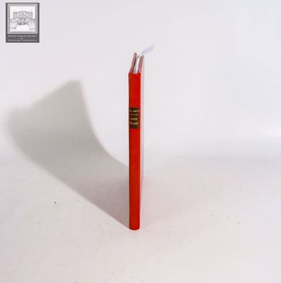 a red book sitting on top of a white table