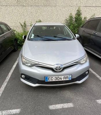 two cars parked in a parking lot next to each other