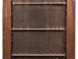 an old wooden picture frame with metal bars on the sides
