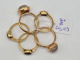 several gold rings with a stone on each of them
