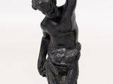 an image of a statue of a man holding a cup in his hand