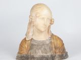marble bust of a woman wearing a brown dress and a brown jacket
