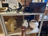 a shelf that has a lamp on top of it