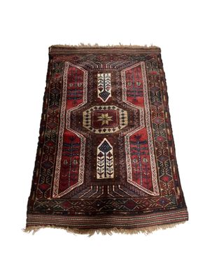 a brown and red rug on a white background