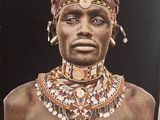 a picture of a man with a necklace on his neck