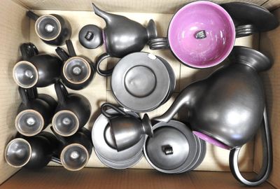 a box full of different types of pots and pans