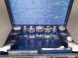 a suitcase with a lot of bottles inside of it